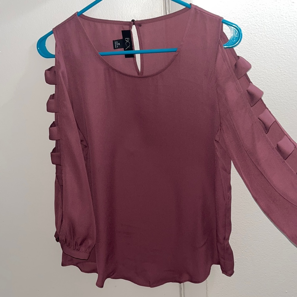 long sleeve top with cut outs along the sleeves
